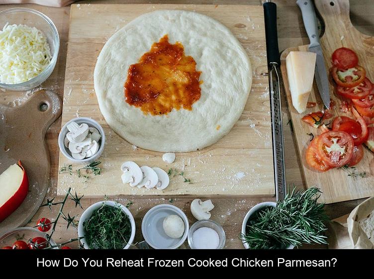 How do you reheat frozen cooked chicken parmesan?